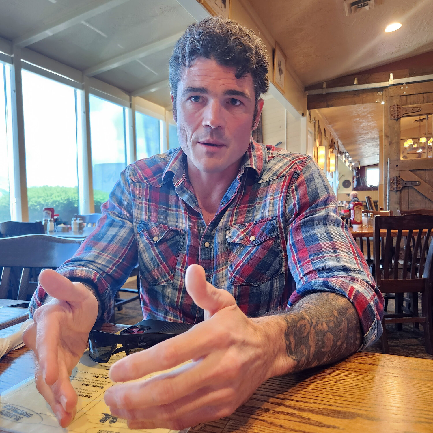 Joe Kent shares his views during an interview with Chronicle columnist Julie McDonald at Ramblin’ Jack’s Ribeye in Napavine last month.
